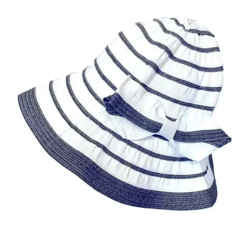 Unbranded bucket hat with a cute bow . Navy blue with white.